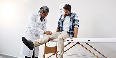 Medical team discussing patient care in hospital corridor